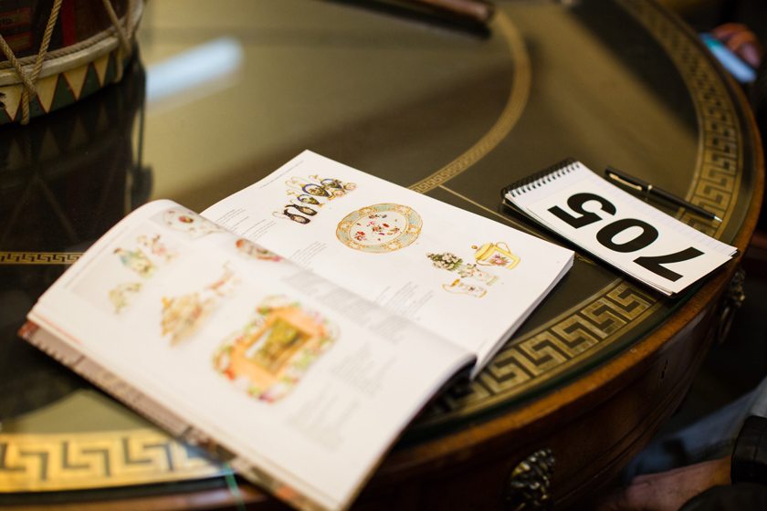 An auction catalogue and bidder number