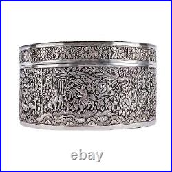A Mid-nineteenth century Chinese Straits silver repousse cylindrical lidded box